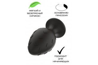 Черная средняя силиконовая анальная пробка с рельефом в виде галочек