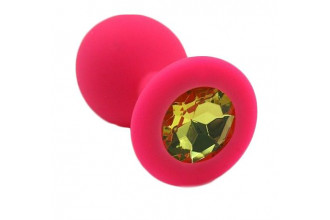 Розовая силиконовая анальная пробка с жёлтым кристаллом - 7 см.