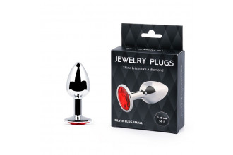 Серебристая анальная пробка с красным стразом - 7,2 см. Серебристая анальная пробка с красным стразом - 7,2 см.