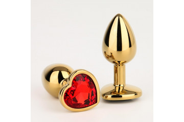 Золотистая анальная пробка с красным кристаллом в форме сердца - 7 см.