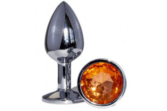 Металлическая анальная втулка с оранжевым кристаллом - 7,2 см.